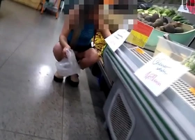 Cristina Almeida's husband recording her in her first exhibitionism video at the neighborhood market