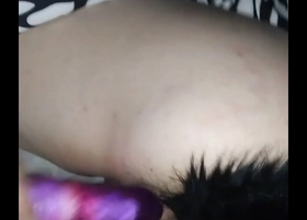 Having a vibrator slammed into her while having an anal plug in