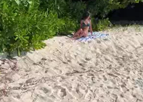 Pissed on girl on a public beach - She was shocked