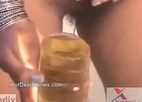 Desi girl pissing in a glass